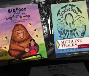 Two books "Bigfoot & Lightning Bug" and "Medicine Tracks"